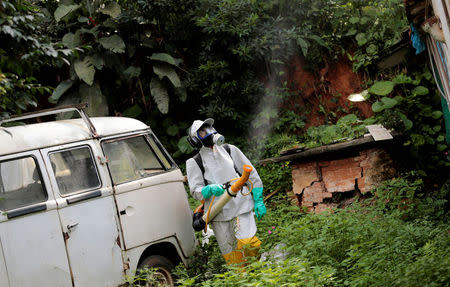 A State Endemics Control health agent fumigates insecticide in an area to kill mosquitoes during a campaign against yellow fever in Sao Paulo, Brazil January 17, 2018. REUTERS/Leonardo Benassatto