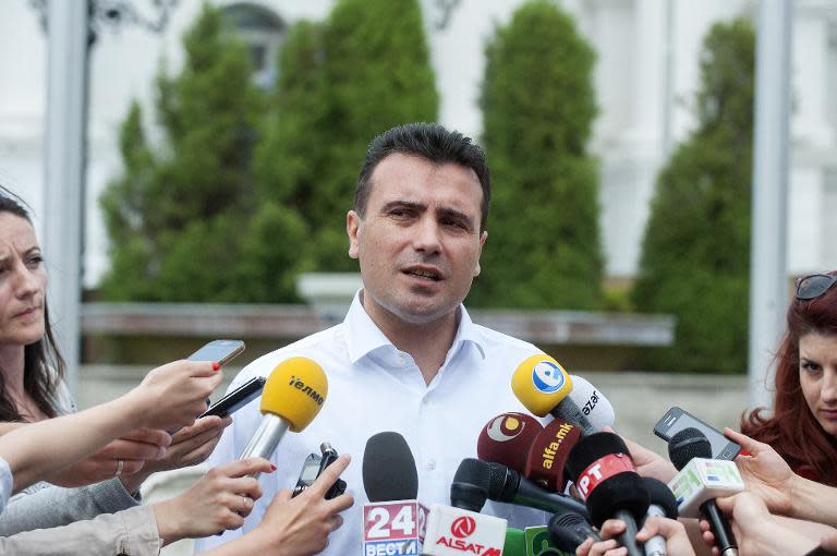 Macedonian opposition leader Zoran Zaev addresses media in front of the Government building in Skopje on May 27, 2015