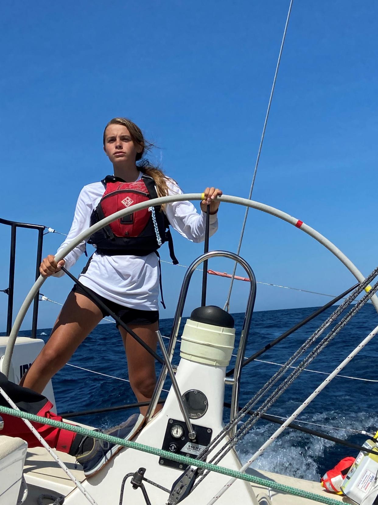 Merritt Sellers steering the J/111 sailboat "nosurprise" in the Beaver Island Race in Harbor Springs, Michigan in August 2021.