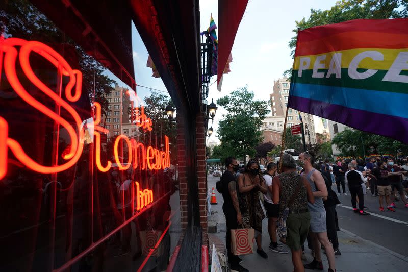 People gather at the Stonewall Inn for a rally in support of the Supreme Court decision to uphold LBGTQ+ workplace rights in New York