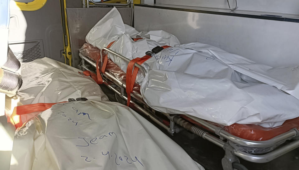 Bodies of the foreign humanitarian aid workers killed in a recent Israeli airstrike in Gaza, are seen on an ambulance as it crosses the Rafah border crossing between Egypt and the Gaza Strip, Wednesday, April 3, 2024. (AP Photo/Ahmed abudraa)