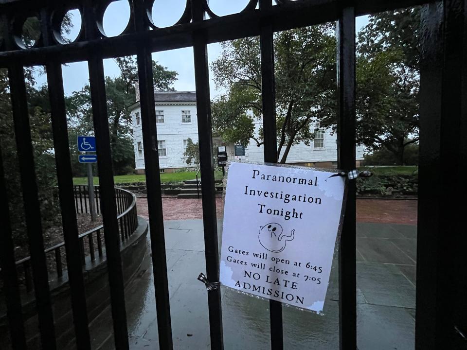 A sign advertising a paranormal investigation tour at Morris-Jumel Mansion.