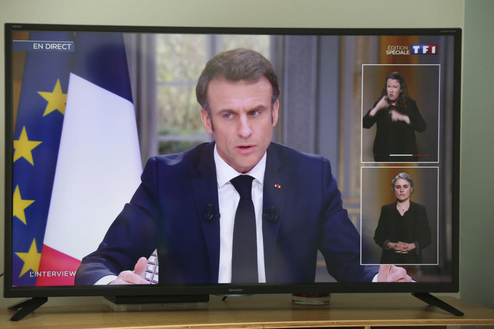 French President Emmanuel Macron is pictured on national television in Saint-Pee sur Nivelle, south-western France, Wednesday, March 22, 2023. French President Emmanuel Macron appeared on national television on Wednesday for the first time since his government forced through the bill age amid mass protests. (AP Photo/Bob Edme)