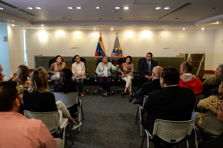 Members of the Venezuelan National Electoral Council during a meeting with members of the ruling party at the CNE headquarters in Caracas, on May 2, 2016