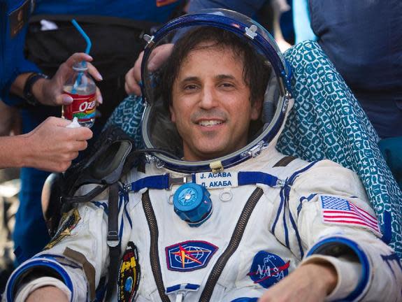 Astronaut Joe Acaba is seen as he rests outside the Soyuz TMA-04M capsule just minutes after he and two crewmates landed in a remote area outside of the town of Arkalyk, Kazakhstan, on Sept. 17, 2012.