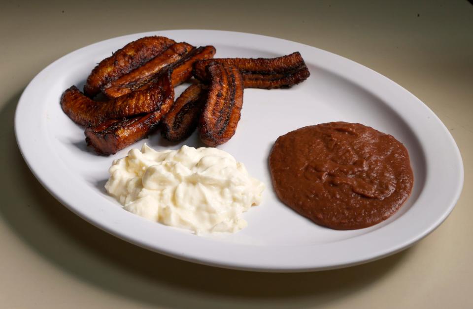 A traditional Salvadoran breakfast of plantains, beans and Salvadoran sour cream is one of many dishes served at La Cuscatleca Inc. in Detroit on Feb. 24, 2022.