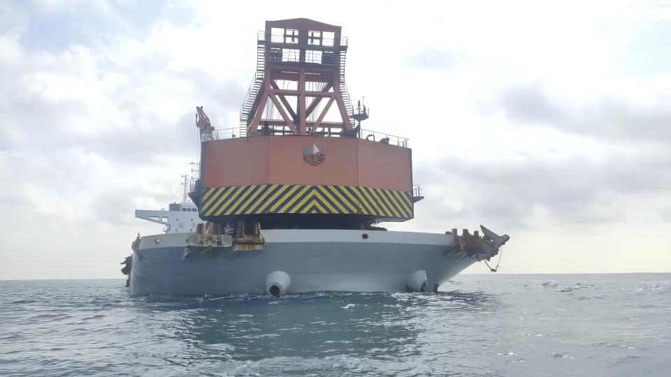 This undated photo released by the Malaysian Maritime Enforcement Agency (MMEA) on Monday, May 29, 2023, show a China-registered bulk carrier ship detained by MMEA for anchoring illegally in the waters of east Johor. Malaysia's maritime agency said Monday it found a cannon shell believed to be from World War II on a Chinese-registered vessel and was investigating if the barge carrier was involved in the looting of two British warship wrecks in the South China Sea. (Malaysian Maritime Enforcement Agency via AP)