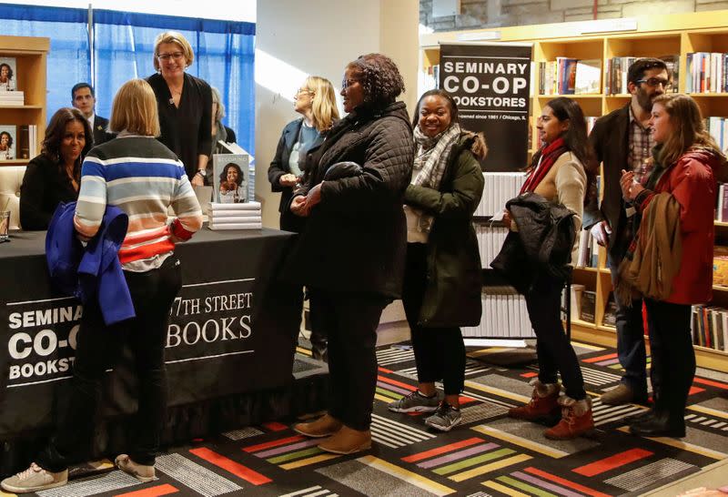 FILE PHOTO: Former first lady Michelle Obama signs copies of her memoir Becoming in Chicago