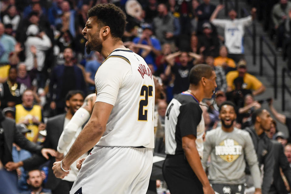 DENVER, CO - MARCH 9: Jamal Murray (27) of the Denver Nuggets celebrates after throwing down a monster dunk over D.J. Wilson (5) of the Milwaukee Bucks during the third quarter on Monday, March 9, 2020. (Photo by AAron Ontiveroz/MediaNews Group/The Denver Post via Getty Images)