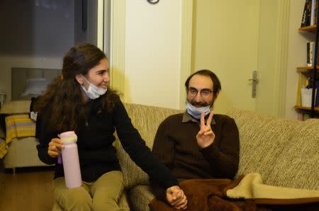 Semih Ozakca, a 28-year-old Turkish teacher who has been on hunger strike for months to protest about losing his job in the government's purge since a failed coup attempt last year and released from jail pending his trial on terrorism-related charges, poses in his home with his wife Esra Ozakca in Ankara, Turkey, October 20, 2017. Picture taken October 20, 2017. Depo Photos via REUTERS