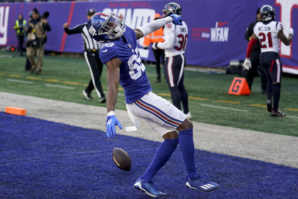 New York Giants wide receiver Darius Slayton (86) reacts after scoring a touchdown against the Houston Texans during the third quarter of an NFL football game, Sunday, Nov. 13, 2022, in East Rutherford, N.J. (AP Photo/Seth Wenig)