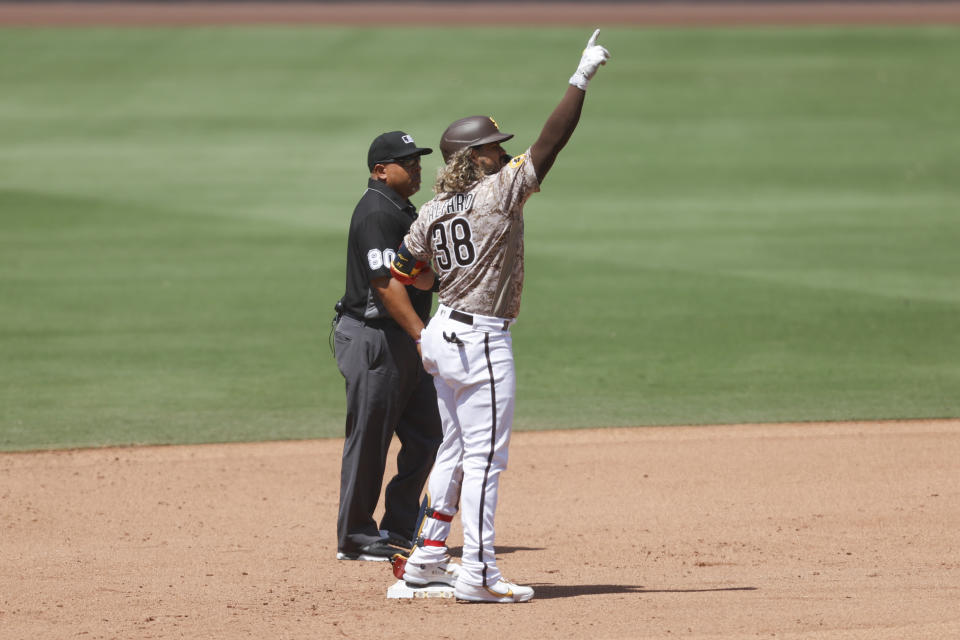 San Diego Padres' Jorge Alfaro (38) celebrates after hitting a double against the Colorado Rockies during the fifth inning of a baseball game Sunday, June 12, 2022, in San Diego. (AP Photo/Mike McGinnis)