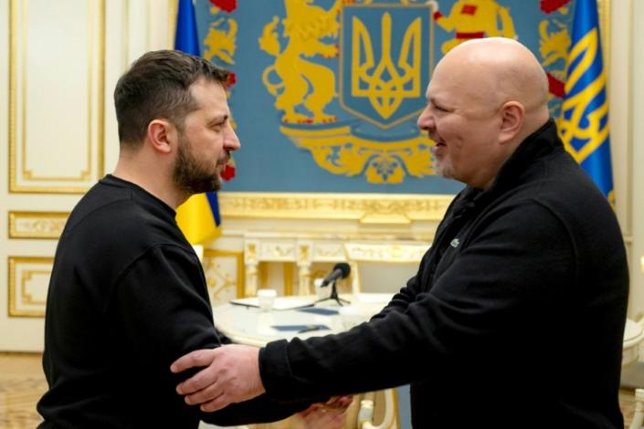 Ukrainian President Volodymyr Zelensky (L) welcoming ICC prosecutor Karim Khan in Kyiv