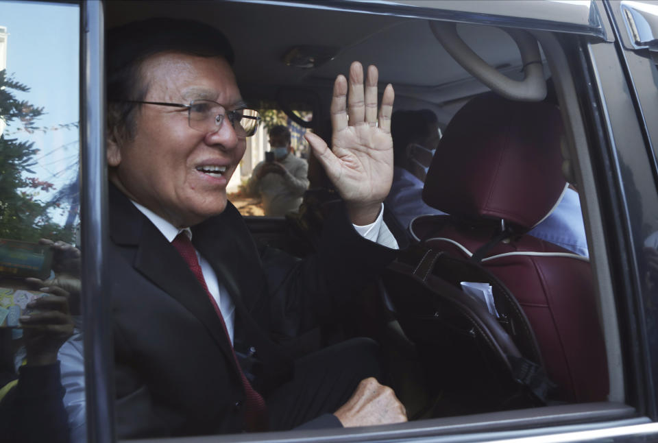 Former President of Cambodia National Rescue Party, Kem Sokha, waves from his car in front of his house in Phnom Penh, Cambodia, Friday, March 3, 2023. Cambodia’s beleaguered pro-democracy forces face another day of reckoning Friday, as the country’s most prominent opposition politician not in exile is scheduled to hear the verdict in his trial for treason.(AP Photo/Heng Sinith)