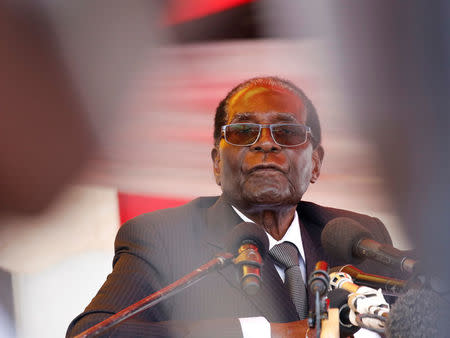 President Robert Mugabe waits to address mourners gathered for the funeral of former cabinet minister and ZANU-PF member Cephas Msipa in Harare, Zimbabwe, October 22, 2016. REUTERS/Philimon Bulawayo