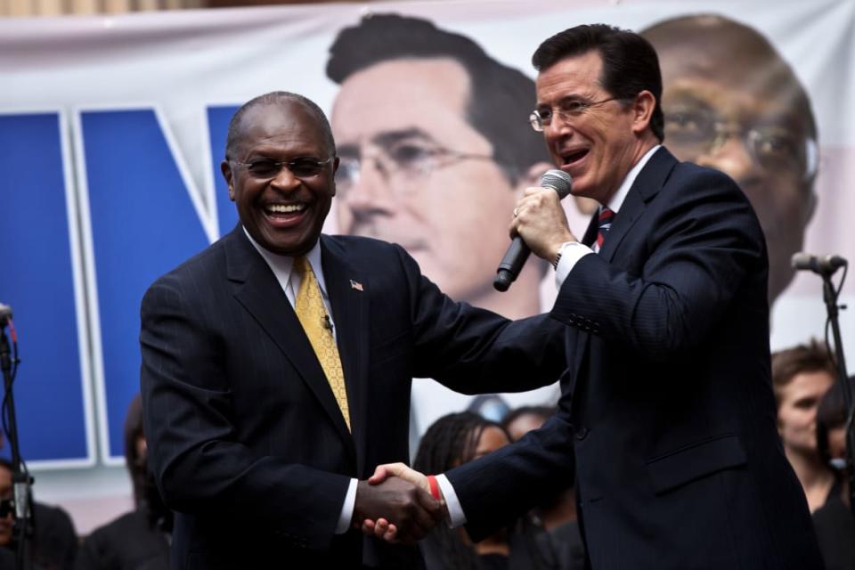 <div class="inline-image__caption"><p>Cain good-naturedly participated in comedian Stephen Colbert’s “Rock Me Like a Herman Cain” rally.</p></div> <div class="inline-image__credit">Richard Ellis/Getty</div>