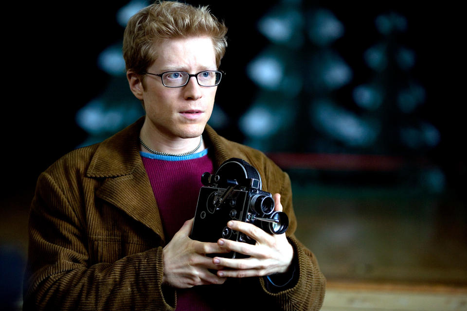 A man holds a camera