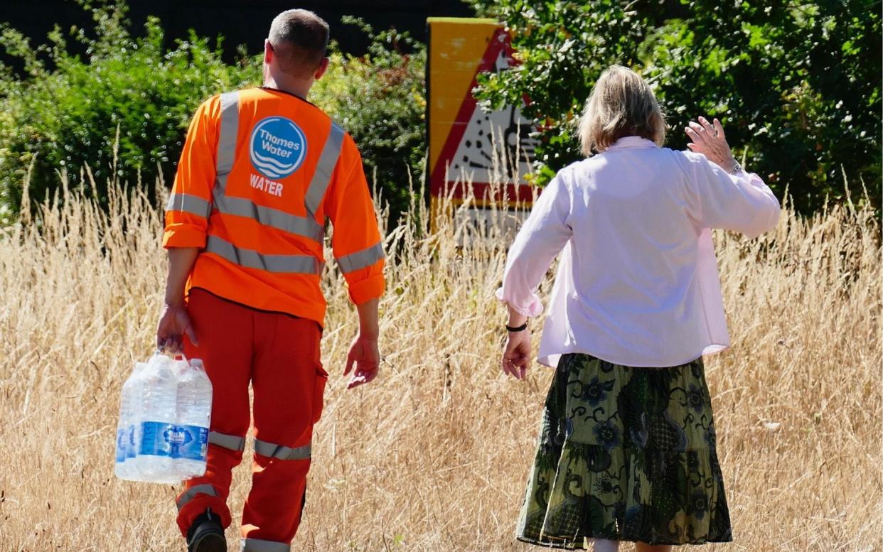 Thames Water workers delivered bottled water to villagers in Northend - Geoffrey Swaine/Shutterstock