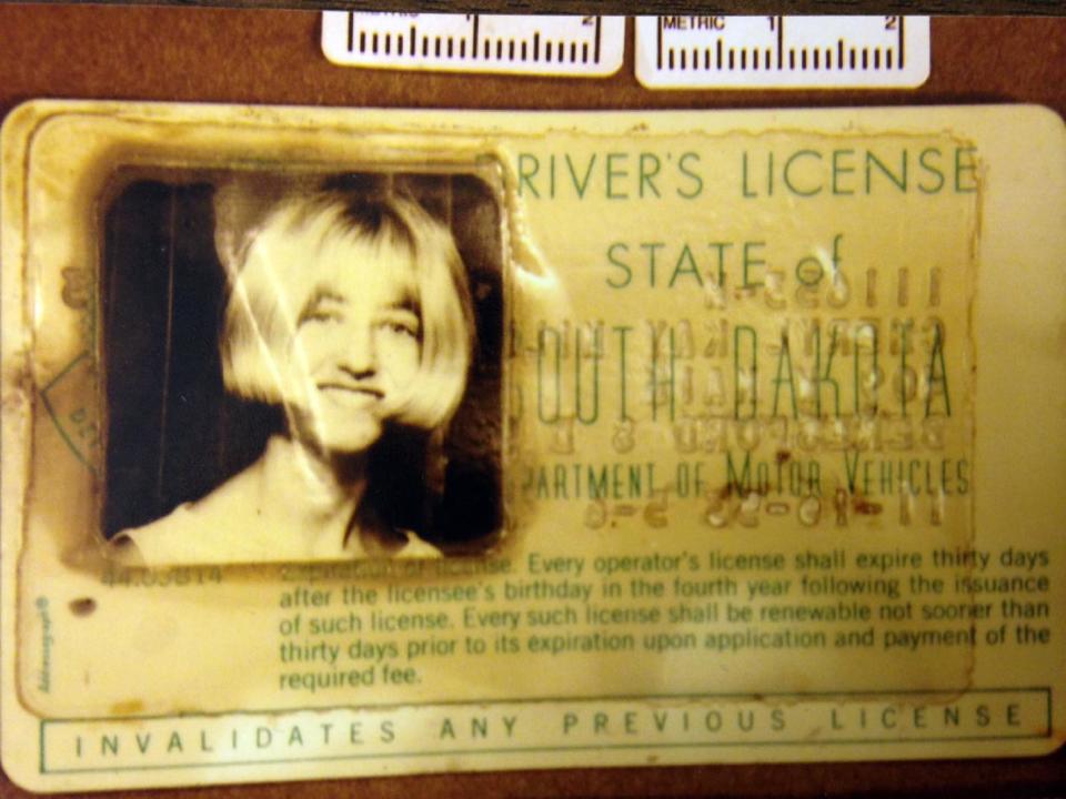 FILE - In this photo provided by the South Dakota Attorney Generals Office is Cheryl Miller's driver's license that was found in a 1960 Studebaker pulled from a creek near Alcester, S.D. Miller and Pamella Jackson were last seen on May 19, 1971 driving to a gathering with classmates to celebrate the end of the school year. On April 15, 2014 authorities confirmed the 43-year-old mystery of the girls disappearance was solved and that the two 17-year-olds had died after driving into the creek. (AP Photo/South Dakota Attorney Generals Office, File)