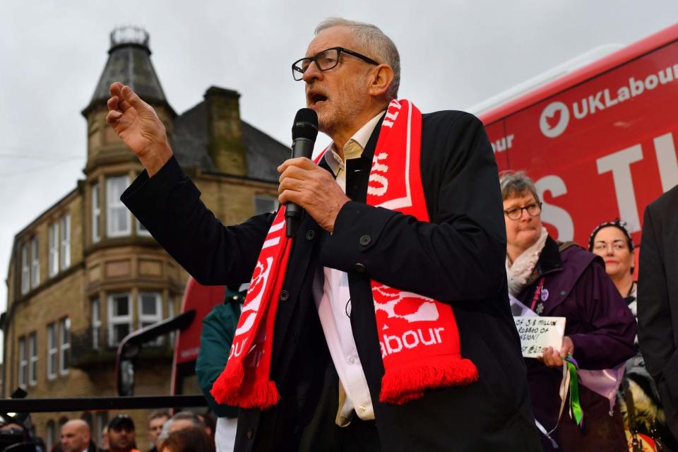 Jeremy Corbyn delivers a speech as he visits Nelson Library i (Getty Images)