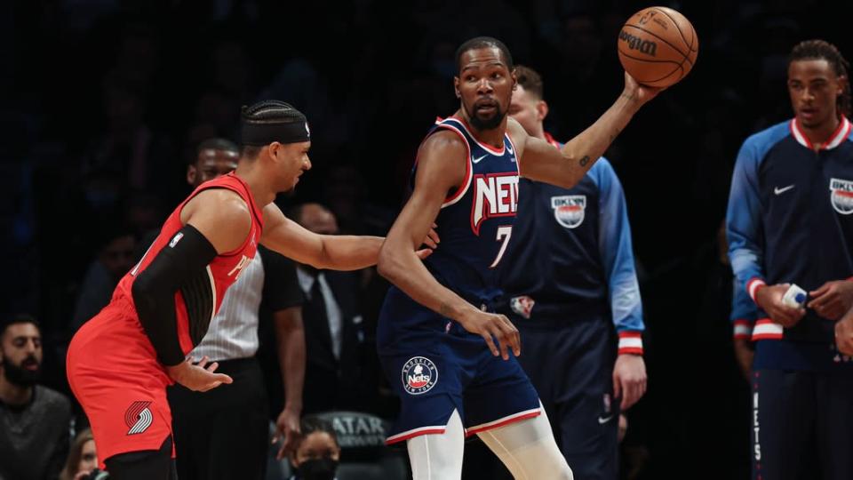 Kevin Durant backs down Blazers defender blue uniform