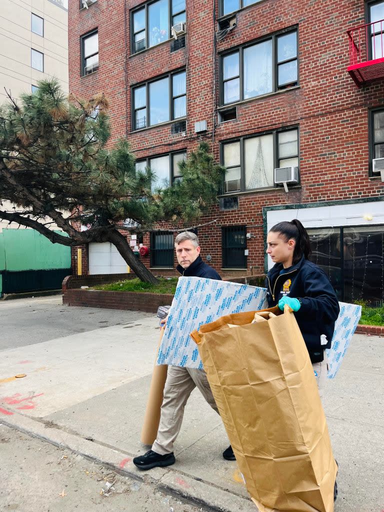 Police remove evidence from the East Flatbush building where Denim Brown, 3 was found dead on Sunday. Georgett Roberts for the NYPost