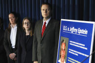 Assistant U.S. Attorney Maurene Comey, left, daughter of former FBI Director James Comey, listens during a news conference, in New York, Monday, July 8, 2019. Federal prosecutors announced sex trafficking and conspiracy charges against wealthy financier Jeffrey Epstein. Court documents unsealed Monday show Epstein is charged with creating and maintaining a network that allowed him to sexually exploit and abuse dozens of underage girls.(AP Photo/Richard Drew)