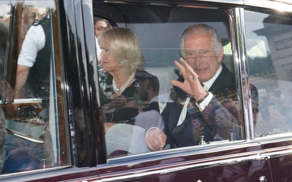 A car carrying King Charles III and The Queen leaving Buckingham Palace - James Manning/PA