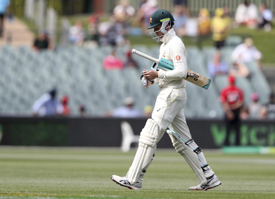 Australia's Peter Handscomb walks from the field after he was dismissed while batting on day four during the first cricket test between Australia and India in Adelaide, Australia,Sunday, Dec. 9, 2018. (AP Photo/James Elsby)
