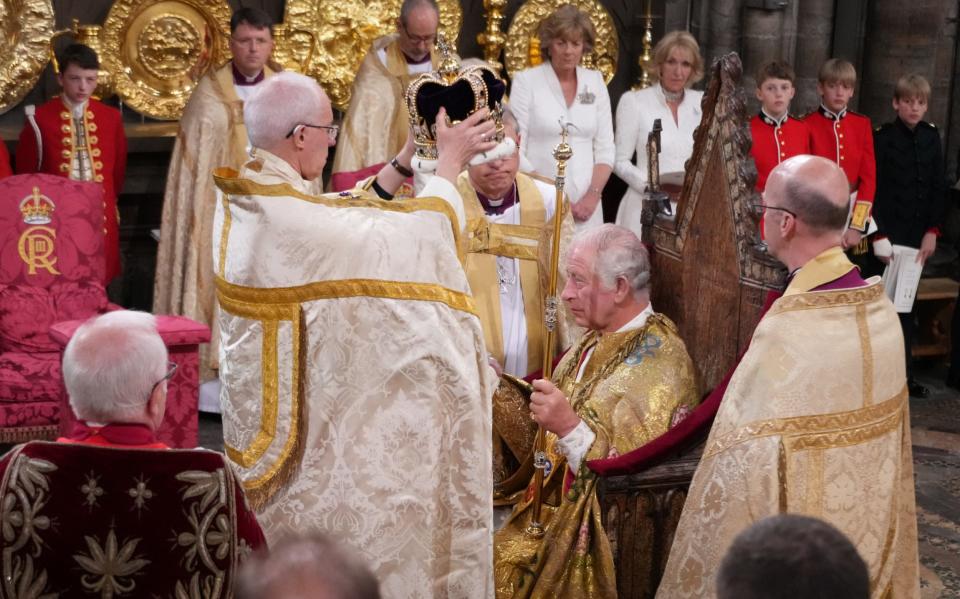 King Charles III is crowned with St Edward's Crown by the Archbishop of Canterbury