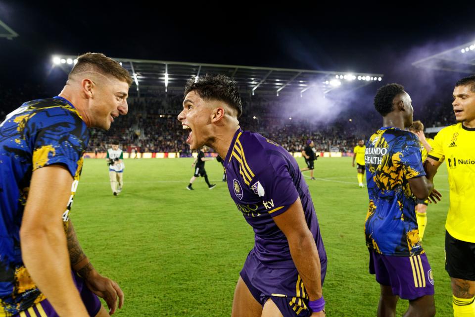 Sep 16, 2023; Orlando, Florida, USA; Orlando City SC forward Ramiro Enrique (7) and forward Gaston Gonzalez (22) celebrate the win against Columbus Crew at Exploria Stadium. Mandatory Credit: Morgan Tencza-USA TODAY Sports