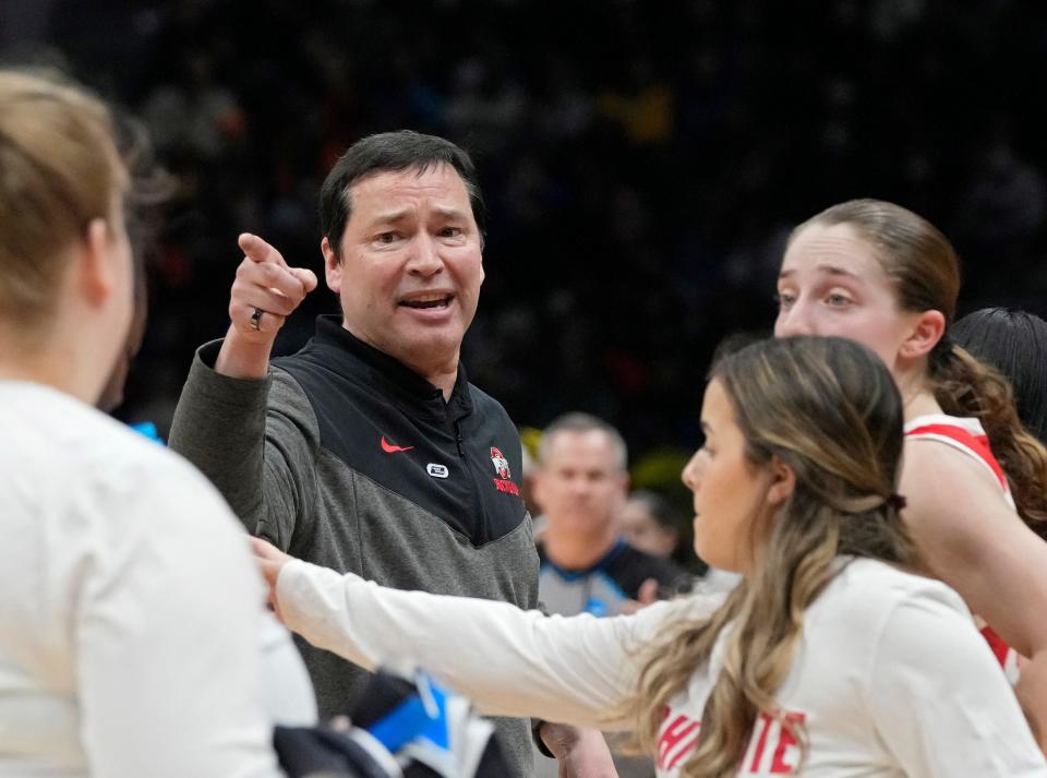 March 25, 2023; Seattle, WA, USA; Ohio State Buckeyes head coach Kevin McGuff speaks to his players during a timeout in the second half of an NCAA Tournament Sweet Sixteen game against the UConn Huskies at Climate Pledge Arena in Seattle on Saturday. Ohio State won the game 73-61.Mandatory Credit: Barbara J. Perenic/Columbus Dispatch