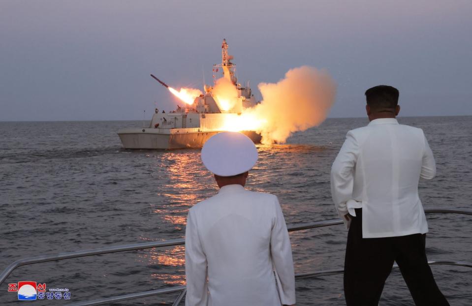 An undated photo released by the official North Korean Central News Agency (KCNA) on 21 August 2023 shows North Korean leader Kim Jong Un (R) inspecting a flotilla of the East Sea Fleet of the Navy of the Korean People’s Army (KPA) in North Korea (EPA)