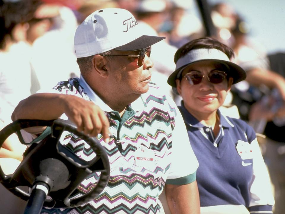 Tiger Woods parents, father Earl Woods and mother Kultida Woodsin cart during Saturday play at Rancho La Quinta CC, La Quinta, CA