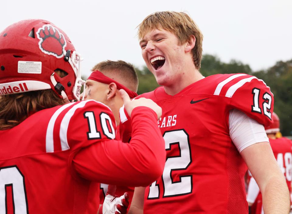 Bridgewater State University quarterback James Cahoon, right, celebrates a school record sixth touchdown passes in a half during their homecoming game versus Fitchburg State University on Saturday, Oct. 01, 2022. 