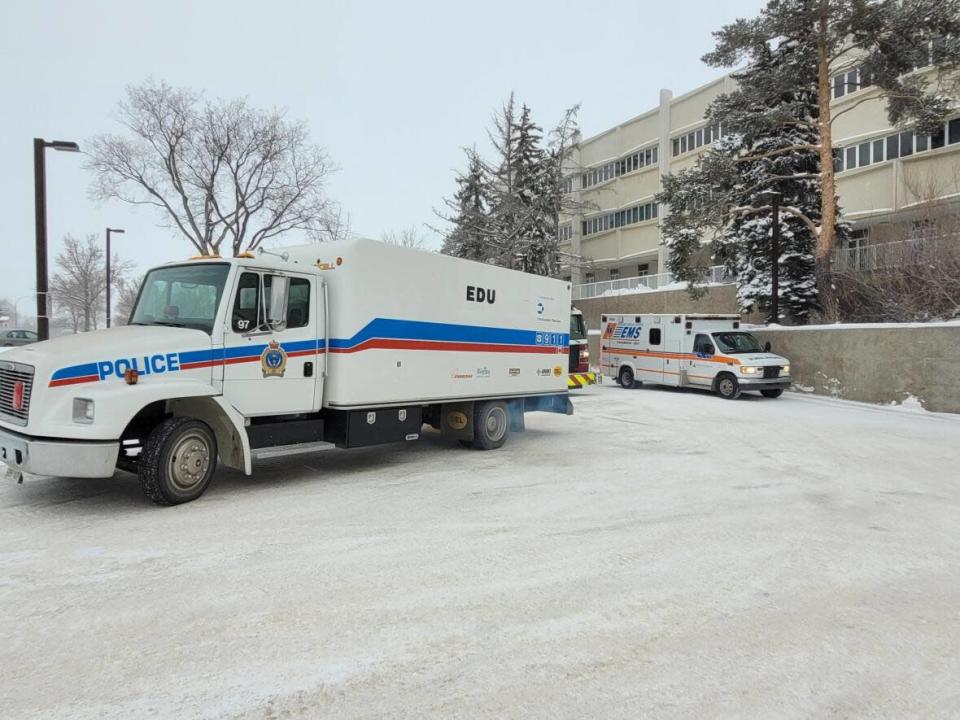 Emergency vehicles were parked outside the University of Regina on Friday in preparation for the detonation of volatile chemicals found last fall in a building at the post-secondary institution. (Submitted by Regina Police Service - image credit)