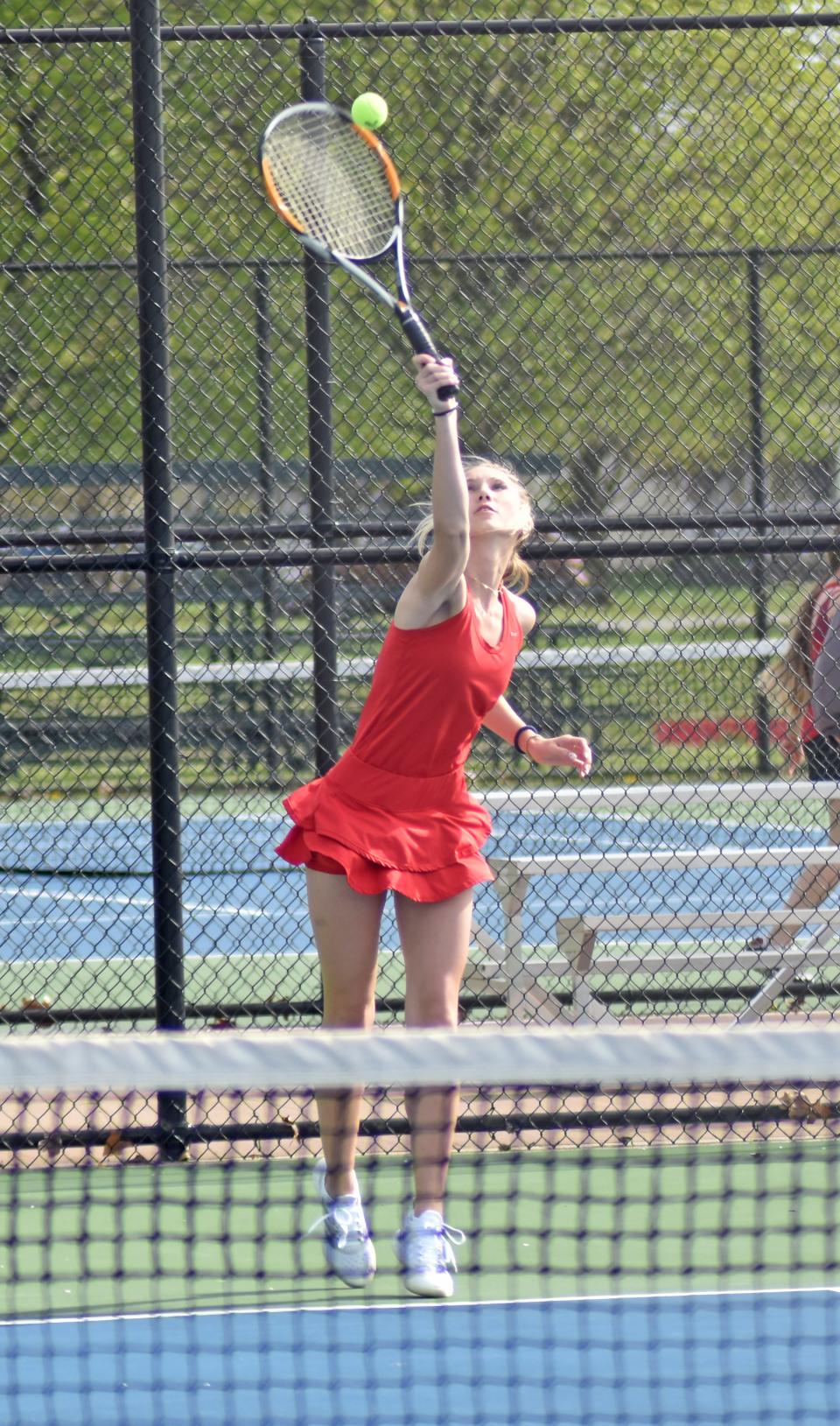 Coldwater's no. 4 singles player Maddie Grife blasts a serve versus Marshall on Monday