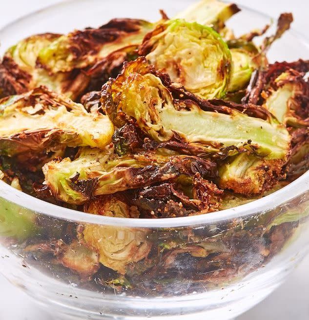 <p>Though the 10 year old version of ourselves would be shocked to hear it, we can't get enough of <a href="https://www.delish.com/uk/cooking/recipes/g33860559/brussel-sprouts-recipe/" rel="nofollow noopener" target="_blank" data-ylk="slk:Brussels sprouts;elm:context_link;itc:0;sec:content-canvas" class="link ">Brussels sprouts</a>. Not only are they are favourite veggie side, they're now our favourite salty, crunchy snack! We love this garlic-parm variety dipped in caesar dressing, but Ranch wouldn't be a bad idea either. 😉 </p><p>Get the <a href="https://www.delish.com/uk/cooking/recipes/a34665643/best-brussels-sprout-chips-recipe/" rel="nofollow noopener" target="_blank" data-ylk="slk:Air Fryer Brussels Sprout Crisps;elm:context_link;itc:0;sec:content-canvas" class="link ">Air Fryer Brussels Sprout Crisps</a> recipe.</p>