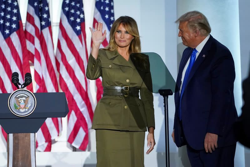 U.S. first lady Melania Trump waves with U.S. President Donald Trump after delivering a live address to the 2020 Republican National Convention from the White House in Washington