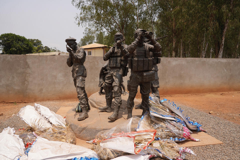 Flowers are laid at the statue of Russian mercenaries as a tribute to the late Wagner leader Yevgeny Prigozhin in Bangui, Central African Republic, on March. 5, 2024. (AP Photo/Sam Mednick)