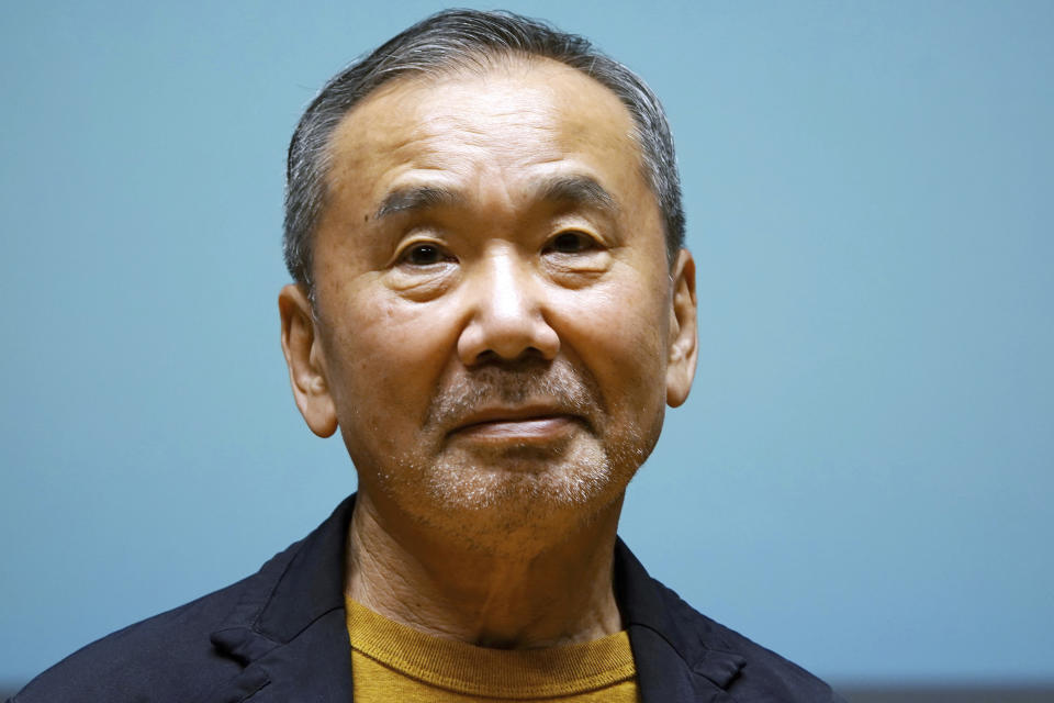 FILE - Japanese novelist Haruki Murakami poses for media during a press conference on the university's new international house of literature, The Haruki Murakami Library, opening at the Waseda University in Tokyo, on Sept. 22, 2021. Murakami spoke up against a controversial redevelopment plan at the heart of Tokyo's beloved historic and green district of Jingu Gaien that would tear down a nearly century-old baseball stadium that inspired him to become a novelist and his favorite running course. (AP Photo/Eugene Hoshiko, File)