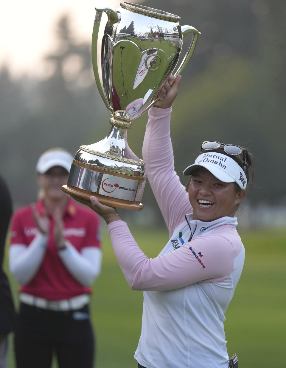 Megan Khang, of the U.S., kisses the trophy after winning the CPKC Women’s Open golf tournament Sunday, Aug. 27, 2023, in Vancouver, British Columbia. (Darryl Dyck/The Canadian Press via AP)