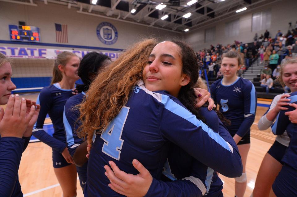 Southside Christian takes on Bamberg-Ehrhardt in the SCHSL Class A State Championship volleyball match, held at Dreher High School in Columbia, Thursday evening, November 4, 2021.Southside players, including Katie Brookins (14) and Julia Muller (4) embrace as they  celebrate their state championship win after the game Thursday night.