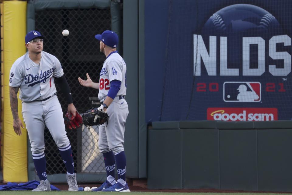 Dodgers starting pitcher Julio Urias warms up with Steve Cilladi