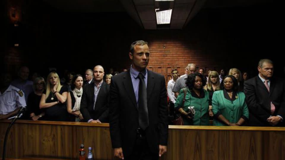 Oscar Pistorius awaits the start of court proceedings in the Pretoria Magistrates court February 19, 2013. Photo: Reuters/SiphiweSibeko