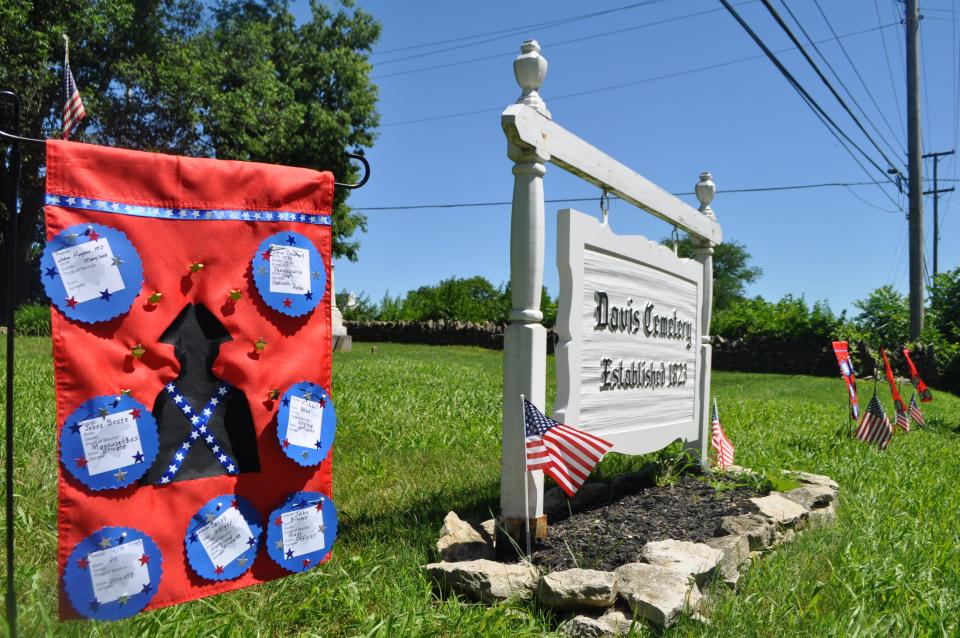These banners depicting the names of Revolutionary War veterans are placed at Davis Cemetery, in Dublin, by members of the Ann Simpson Davis Chapter of the Daughters of the American Revolution.