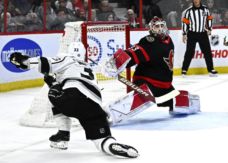 Los Angeles Kings right wing Viktor Arvidsson, left, scores on Ottawa Senators goaltender Cam Talbot during the first period of an NHL hockey game Tuesday, Dec. 6, 2022, in Ottawa, Ontario. (Justin Tang/The Canadian Press via AP)