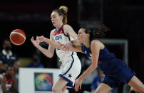 Serbia's Jelena Brooks (9), right, tries to steal the ball from United States' Breanna Stewart (10) during women's basketball semifinal game at the 2020 Summer Olympics, Friday, Aug. 6, 2021, in Saitama, Japan. (AP Photo/Charlie Neibergall)