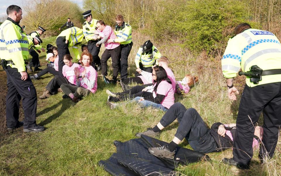 Protesters are detained by police on Grand National day at Aintree - Grand National protesters blamed for death of Hill Sixteen by horse’s trainer - PA/Tim Goode