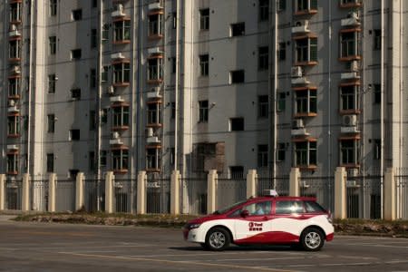 FILE PHOTO: A BYD E6 electric car, used as a taxi in Shenzhen, is seen in a car park in the southern Chinese city of Shenzhen May 24, 2010.   REUTERS/Tyrone Siu/File Photo